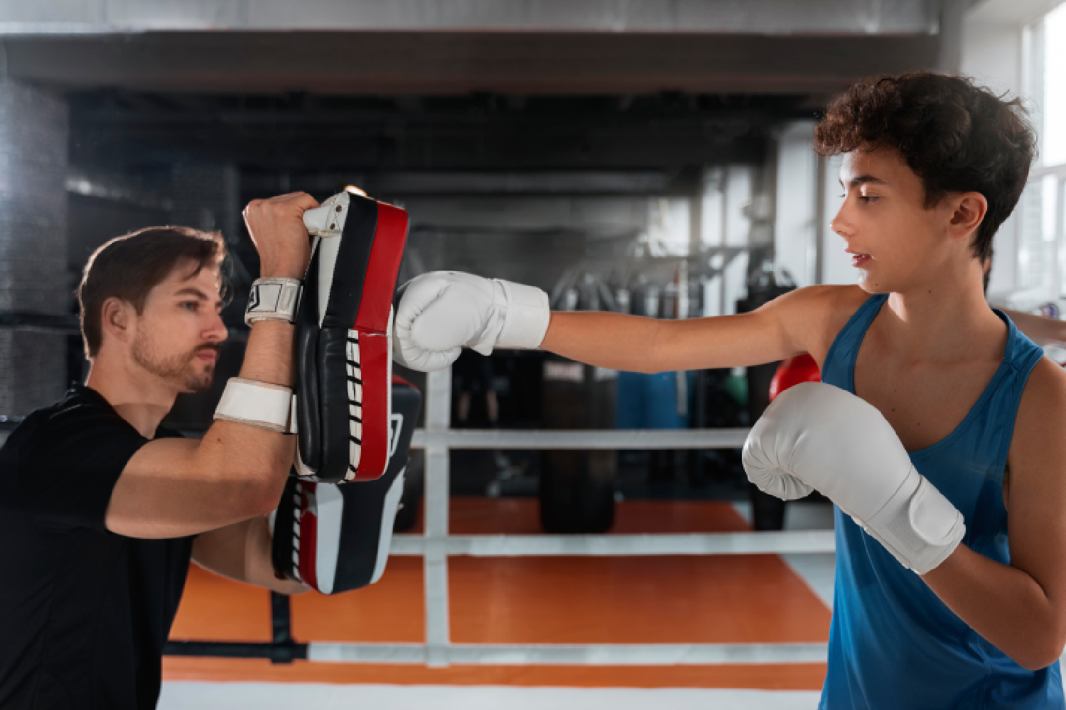 Students practicing controlled grappling techniques during mixed martial arts (MMA) classes Seoni.